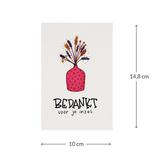 Bloemenzaden met kaart 'Bedankt voor je inzet' verpakt in pergamijn zakje